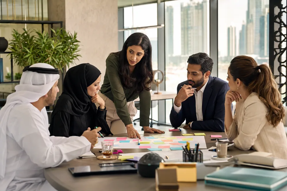 Multicultural employee team collaborating during an enablement workshop